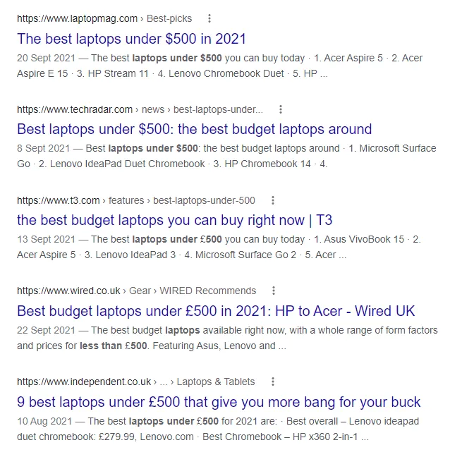 Screenshot of Google search results for 'laptops under $500' showing primarily review articles.