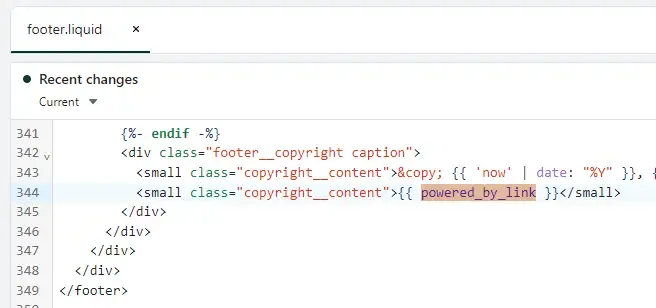 Screenshot showing powered_by_link code in Shopify footer.liquid file